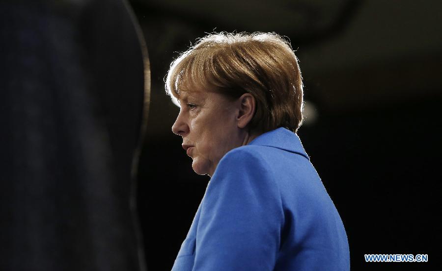 German Chancellor Angela Merkel speaks during a press conference with European Commission President Jean-Claude Juncker (not seen) at the end of her visit to the European Commission at the EU headquarters in Brussels, Belgium, on March 4, 2015.