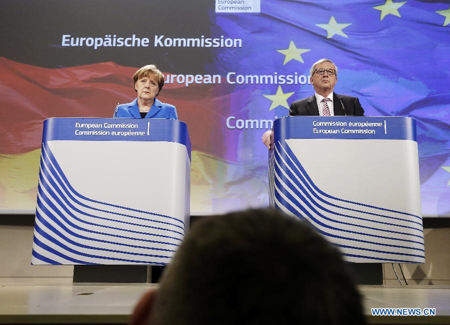 German Chancellor Angela Merkel (L) and European Commission President Jean-Claude Juncker attend a press conference in Brussels, Belgium, on March 4, 2015.