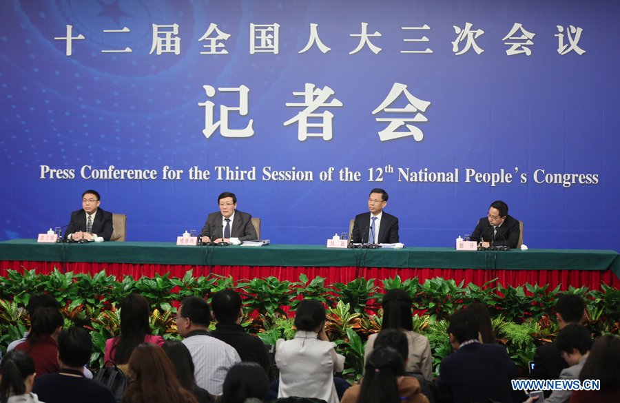 Chinese finance minister Lou Jiwei (2nd L, back) and vice finance minister Liu Kun(2nd R, front) give a press conference for the third session of China's 12th National People's Congress (NPC) on fiscal and tax reform, in Beijing, capital of China, March 6, 2015.