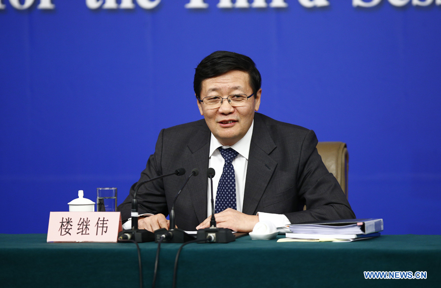 Chinese finance minister Lou Jiwei answers questions during a press conference for the third session of China's 12th National People's Congress (NPC) on fiscal and tax reform, in Beijing, capital of China, March 6,2015.