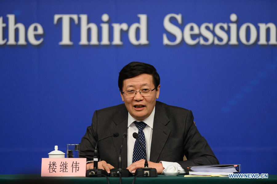 Chinese finance minister Lou Jiwei attends a press conference for the third session of China's 12th National People's Congress (NPC) on fiscal and tax reform, in Beijing, capital of China, March 6, 2015.