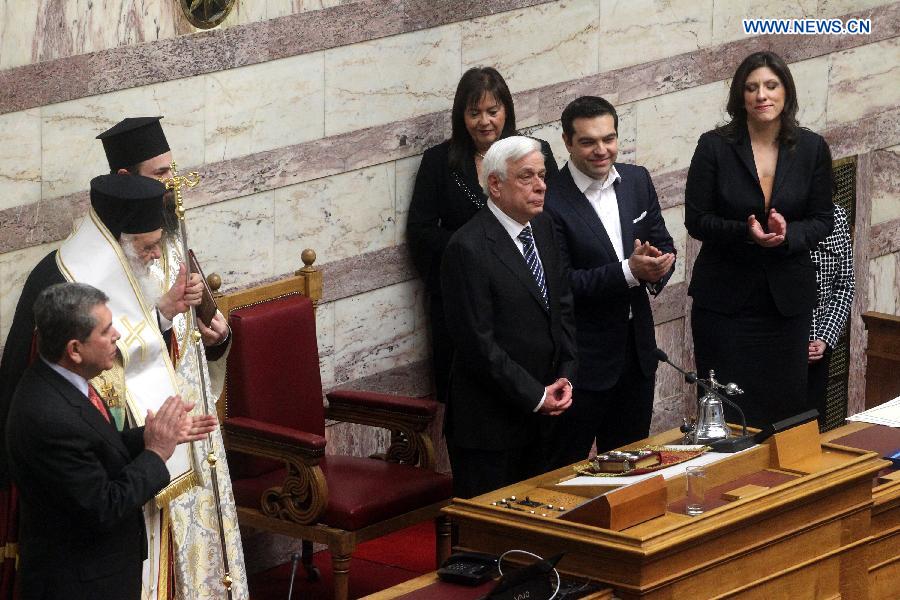 Newly elected Greek President Prokopis Pavlopoulos(C) takes part in a swearing-in ceremony inside the parliament in Athens, Greek, on March 13, 2015. 