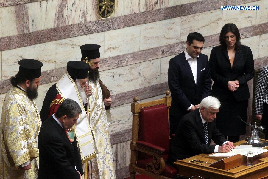 Newly elected Greek President Prokopis Pavlopoulos(3rd R) takes part in a swearing-in ceremony inside the parliament in Athens, Greek, on March 13, 2015. 