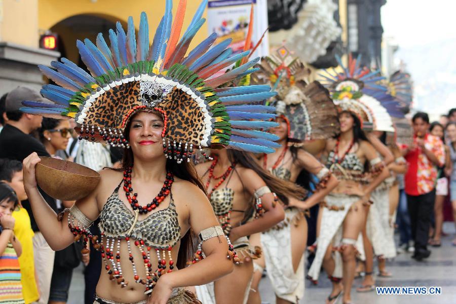 Peruvian dancers perform during the 'Parade of the World Cultures' in the framework of the 8th International Meeting of Folklore 'My Peru 2015', in Lima city, capital of Peru, on March 14, 2015.