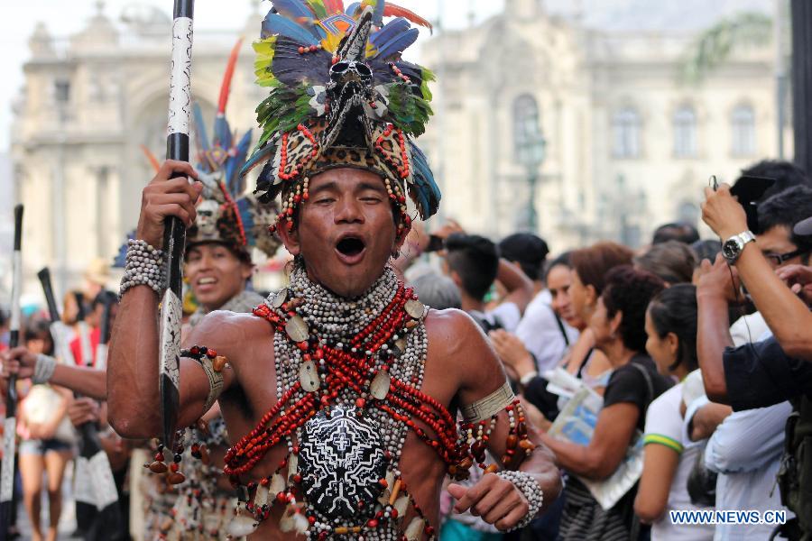 A Peruvian dancer performs during the 'Parade of the World Cultures' in the framework of the 8th International Meeting of Folklore 'My Peru 2015', in Lima city, capital of Peru, on March 14, 2015.