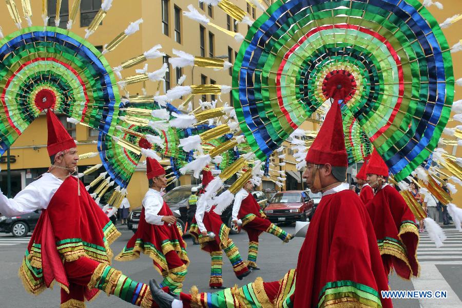 Mexican dancers perform during the 'Parade of the World Cultures' in the framework of the 8th International Meeting of Folklore 'My Peru 2015', in Lima city, capital of Peru, on March 14, 2015