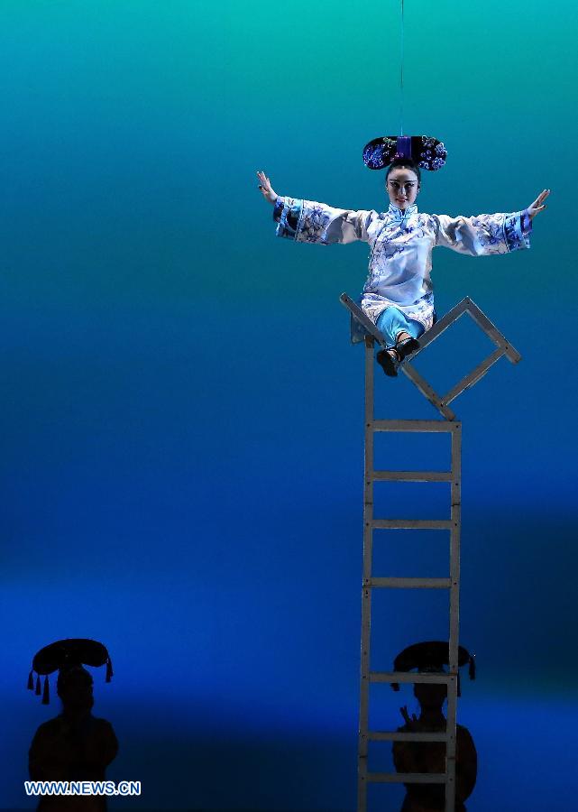 Chinese acrobats perform in an acrobatic show titled 'The Forbidden City' at the Old Opera House in Frankfurt, Germany on March 10, 2015. 