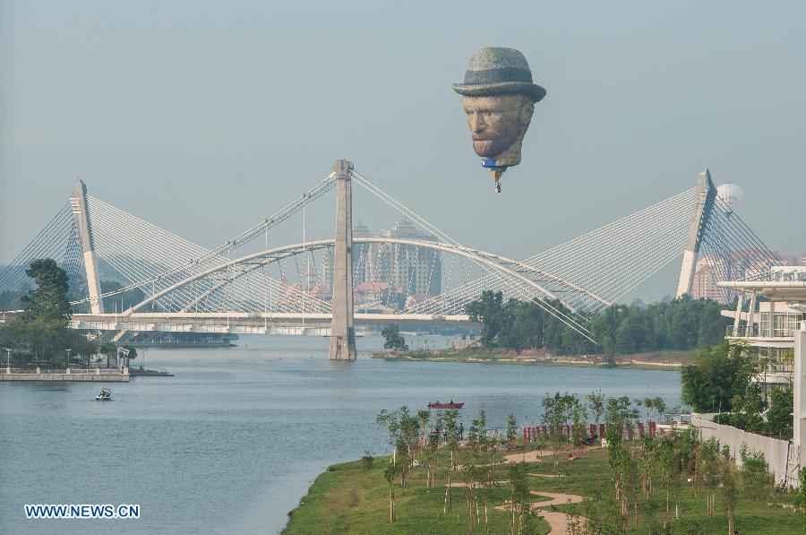 A balloon depicting Vincent van Gogh flies during the first day of the 7th Putrajaya Hot Air Balloon Fiesta in Putrajaya, Malaysia on March 12, 2015. Seventeen hot air balloon teams participated in the annual 4-day event.