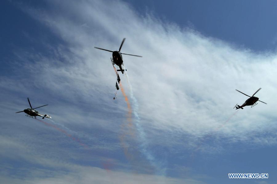 Pakistani army helicopters fly over during a rehearsal for the upcoming Pakistan Day celebrations in southwest Pakistan's Quetta on March 22, 2015. 