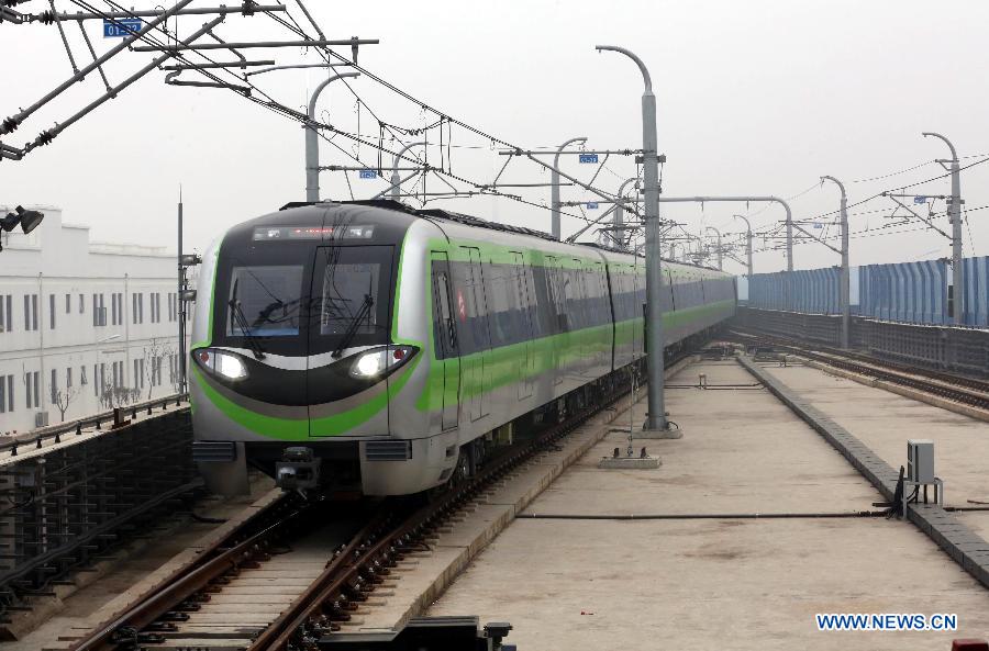A subway train of the Subway Line 3 pulls into the Linchang Station in Nanjing, capital of east China's Jiangsu Province, April 1, 2015. The 44.87-kilometer-long Subway Line 3 in Nanjing was put into trial operation on Wednesday, making the total length of the city's subway reach 225 kilometers, the fourth longest in China. (Xinhua/Yan Minhang)
