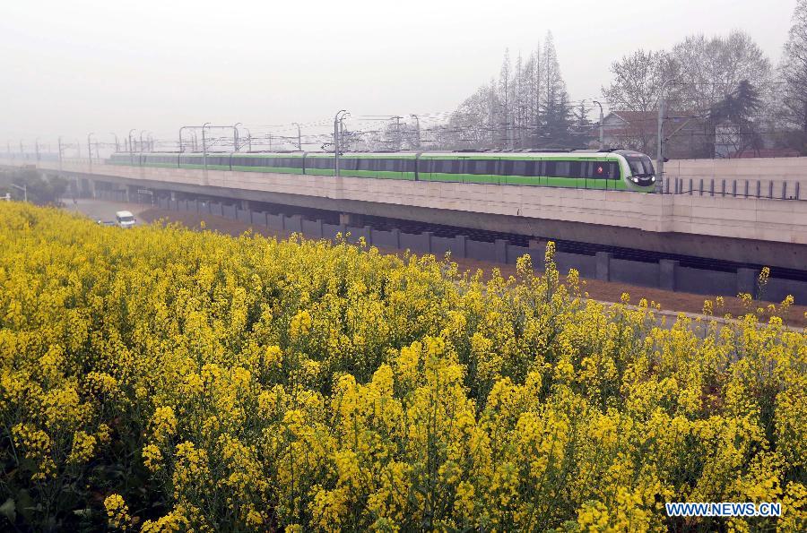 A subway train of the Subway Line 3 pulls into the Linchang Station in Nanjing, capital of east China's Jiangsu Province, April 1, 2015. The 44.87-kilometer-long Subway Line 3 in Nanjing was put into trial operation on Wednesday, making the total length of the city's subway reach 225 kilometers, the fourth longest in China. (Xinhua/Yan Minhang)