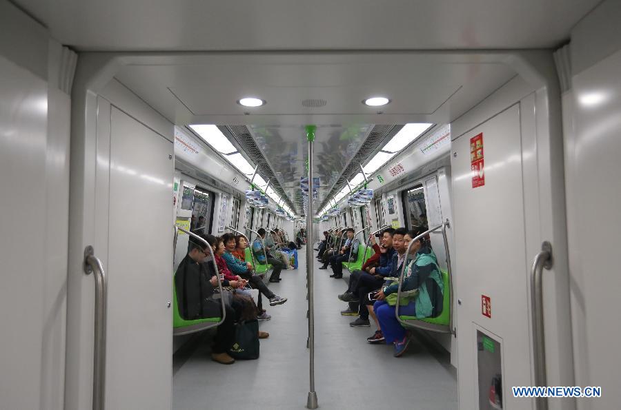 Residents take a subway train on the Subway Line 3 in Nanjing, capital of east China's Jiangsu Province, April 1, 2015. The 44.87-kilometer-long Subway Line 3 in Nanjing was put into trial operation on Wednesday, making the total length of the city's subway reach 225 kilometers, the fourth longest in China. (Xinhua/Yan Minhang)