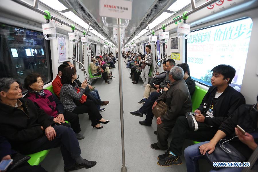 Residents take a subway train on the Subway Line 3 in Nanjing, capital of east China's Jiangsu Province, April 1, 2015. The 44.87-kilometer-long Subway Line 3 in Nanjing was put into trial operation on Wednesday, making the total length of the city's subway reach 225 kilometers, the fourth longest in China. (Xinhua/Yan Minhang) 