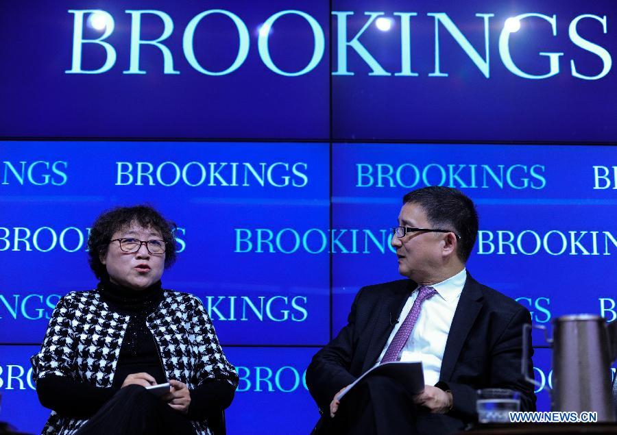 Fellow of the Institute of Sociology at Chinese Academy of Social Sciences, Li Yinhe (L) speaks during a session of panel discussions moderated by Li Cheng, director of the John L. Thornton China Center at the Brookings Institute, in Washington D.C., capital of the United States, April 3, 2015.