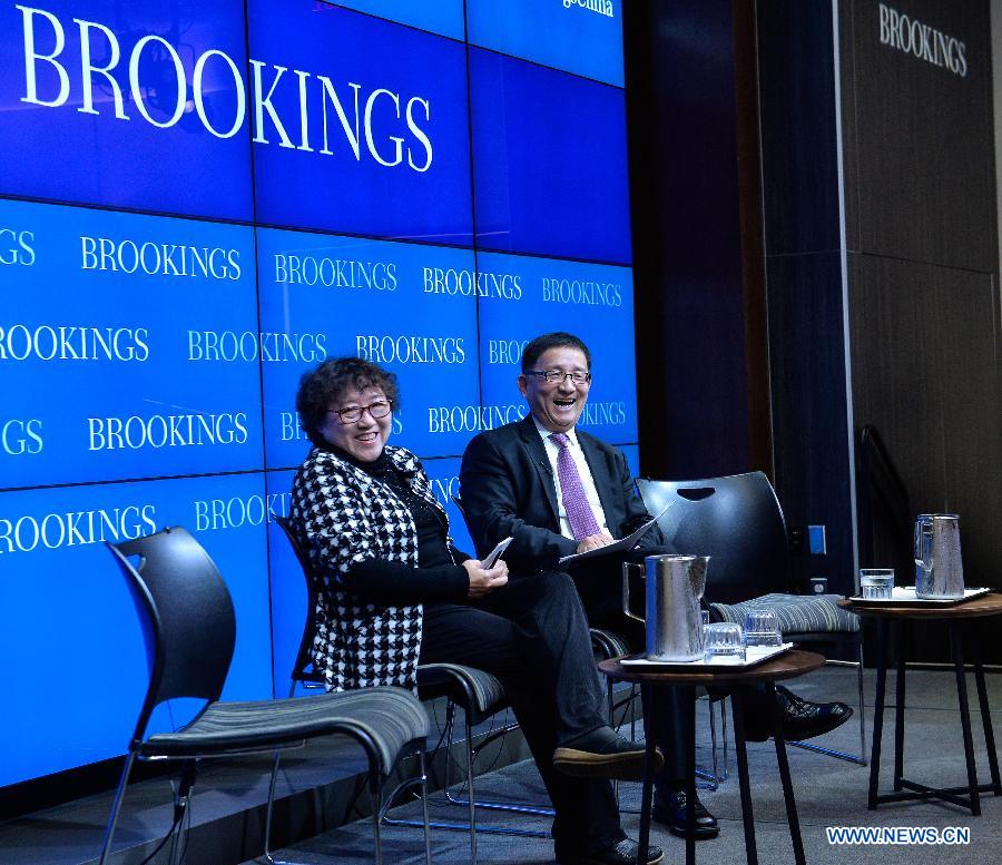 Fellow of the Institute of Sociology at Chinese Academy of Social Sciences, Li Yinhe (L) speaks during a session of panel discussions moderated by Li Cheng, director of the John L. Thornton China Center at the Brookings Institute, in Washington D.C., capital of the United States, April 3, 2015.