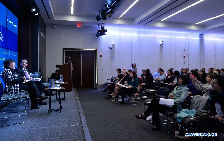 Fellow of the Institute of Sociology at Chinese Academy of Social Sciences, Li Yinhe (1st L) speaks during a session of panel discussions moderated by Li Cheng (2nd L), director of the John L. Thornton China Center at the Brookings Institute, in Washington D.C., capital of the United States, April 3, 2015. 