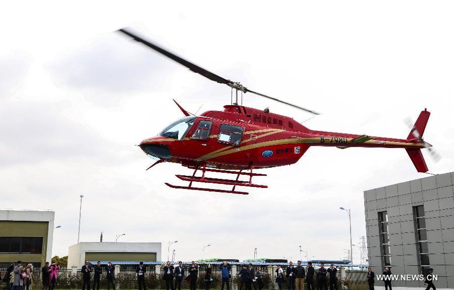 A helicopter flies in a demonstration flight at a helicopter store in Ningbo, east China's Zhejiang Province, April 8, 2015. The helicopter store was open on Wednesday. (Xinhua) 