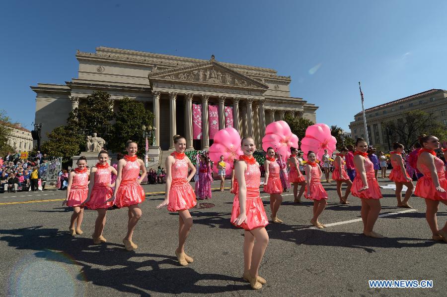 Girls perform during the annual Cherry Blossom Festival Parade along the Constitution Avenue in Washington D.C., capital of the United States, April 11, 2015. 