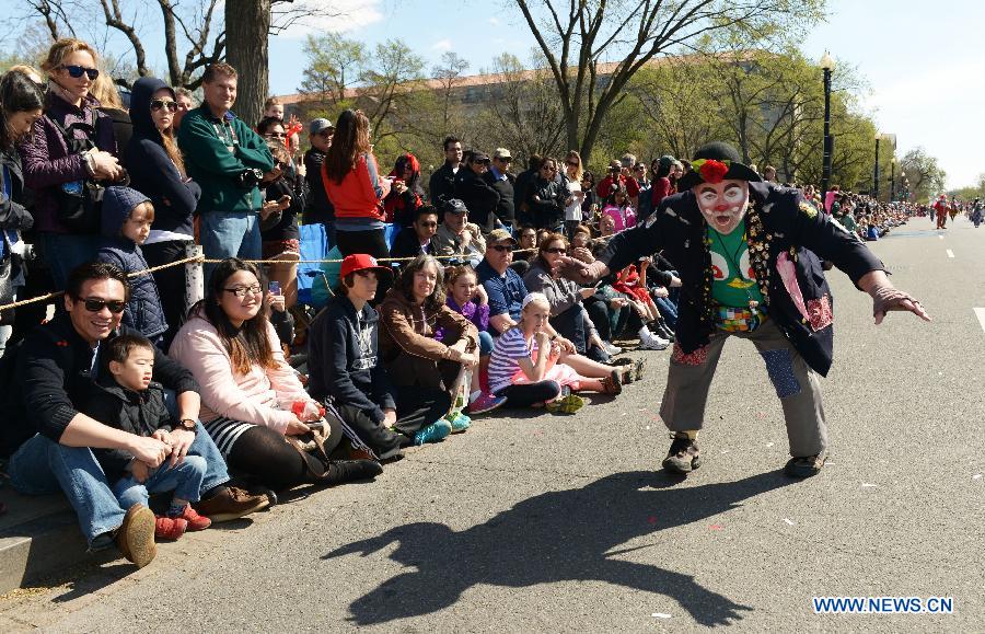 A man dressed as clown attends the annual Cherry Blossom Festival Parade along the Constitution Avenue in Washington D.C., capital of the United States, April 11, 2015.