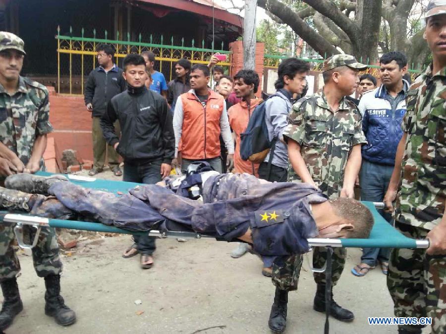 A victim's body is carried out from a collapsed building in Nepal's capital Kathmandu April 25, 2015.