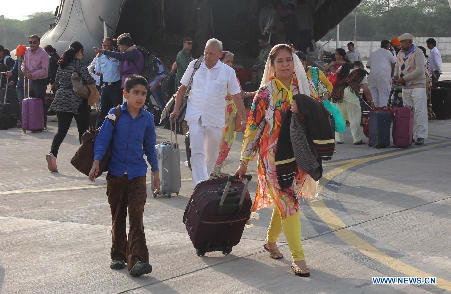 Indian nationals get off an Indian Air Force C-17 aircraft at Air Force Station in New Delhi, India, April 26, 2015.