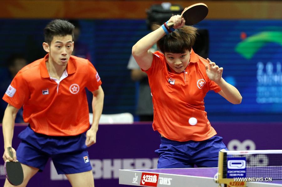 Hong Kong China's Wong Chun Ting/Doo Hoi Kem(R) compete against Japan's Niwa Koki/Hirano Sayaka during Mixed Doubles match at the 53rd Table Tennis World Championships in Suzhou, city of east China's Jiangsu Province, on April 29, 2015. Hong Kong China's Wong Chun Ting/Doo Hoi Kem won 4-0. (Xinhua/Yang Shiyao) 