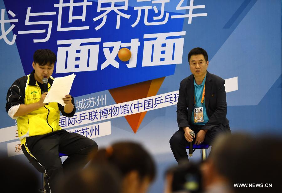 Shi Zhihao(R), Vice President of ITTF, accepts interview during an promotional movement in Suzhou, city of east China's Jiangsu Province and the host city of the 53rd Table Tennis World Championships. (Xinhua/Song Zhenping) 