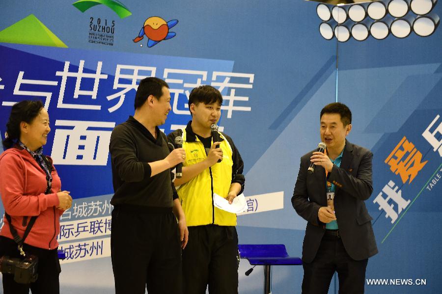 Shi Zhihao, Vice President of ITTF, chats with fans during a promotional movement in Suzhou, city of east China's Jiangsu Province and the host city of the 53rd Table Tennis World Championships. (Xinhua/Song Zhenping) 