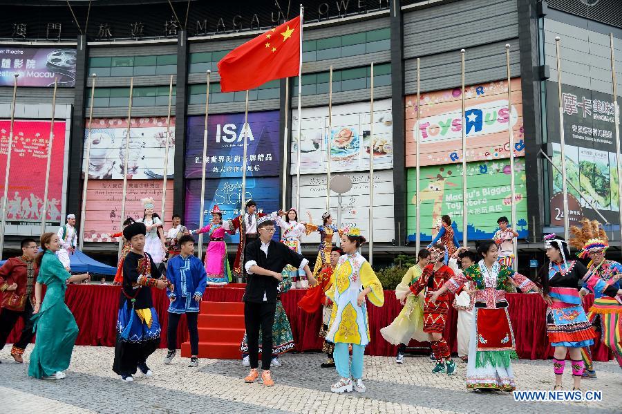 Young people give a performance during a national flag-raising ceremony in Macao, south China, May 4, 2015. More than 1,000 people including representatives of 43 schools and 19 youth communities and Macao SAR officials on Monday took part in the national flag-raising ceremony to celebrate the Chinese Youth Day marking the May 4th Movement that happened on May 4, 1919, ushering in the new-democratic revolution in China. (Xinhua/Cheong Kam Ka) 