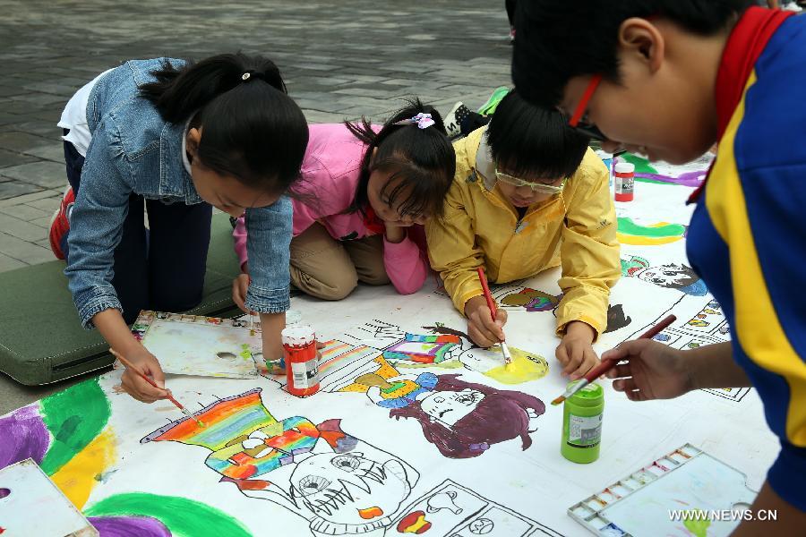 The ten-day painting and calligraphy exhibition, displaying more than 300 works created by primary school students, opened in Beijing Tuesday. 