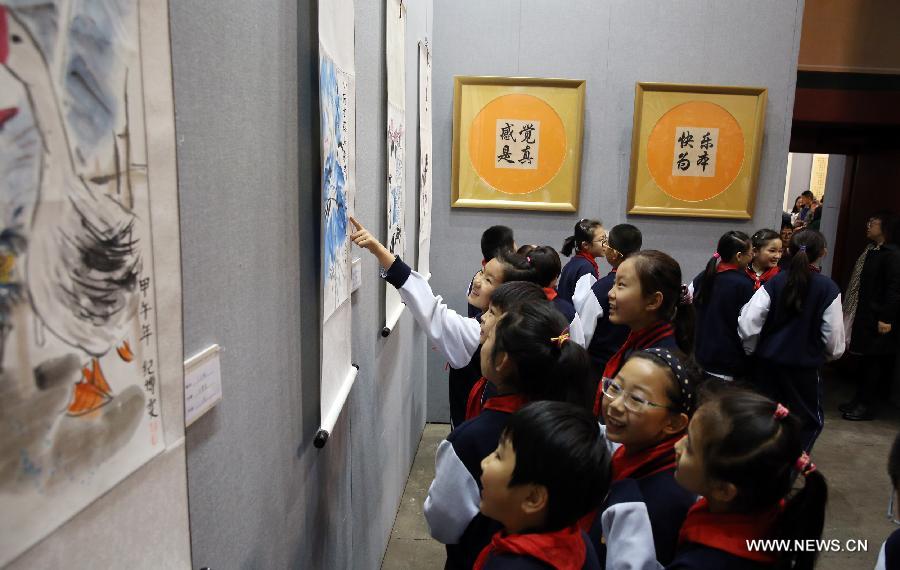 The ten-day painting and calligraphy exhibition, displaying more than 300 works created by primary school students, opened in Beijing Tuesday. 