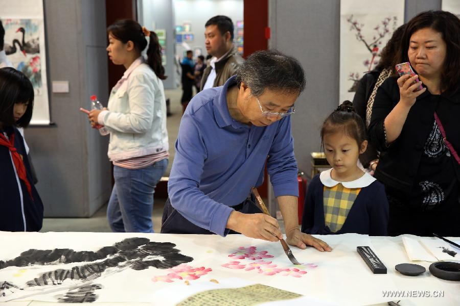 The ten-day painting and calligraphy exhibition, displaying more than 300 works created by primary school students, opened in Beijing Tuesday. 