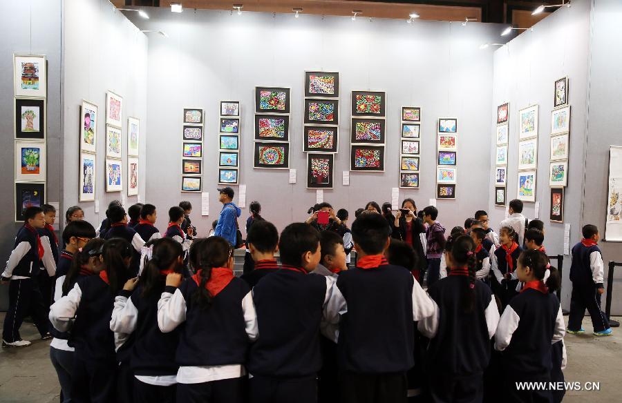 The ten-day painting and calligraphy exhibition, displaying more than 300 works created by primary school students, opened in Beijing Tuesday. 