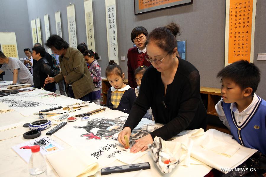 The ten-day painting and calligraphy exhibition, displaying more than 300 works created by primary school students, opened in Beijing Tuesday. 