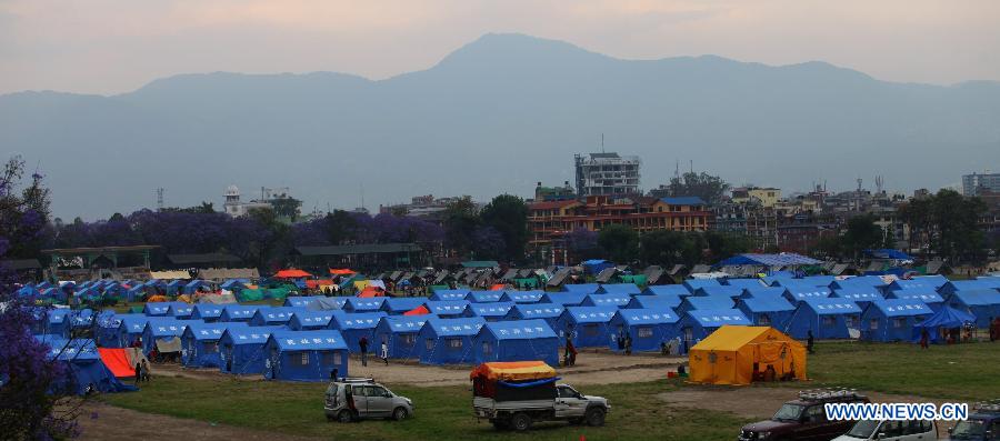 People stay at a temporary settlement at Tundikhel in Kathmandu, Nepal, May 16, 2015.