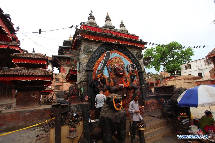 People offer prayers to God Kal Bhairav at Hanumandhoka Durbar Square in Kathmandu, Nepal, May 16, 2015. 