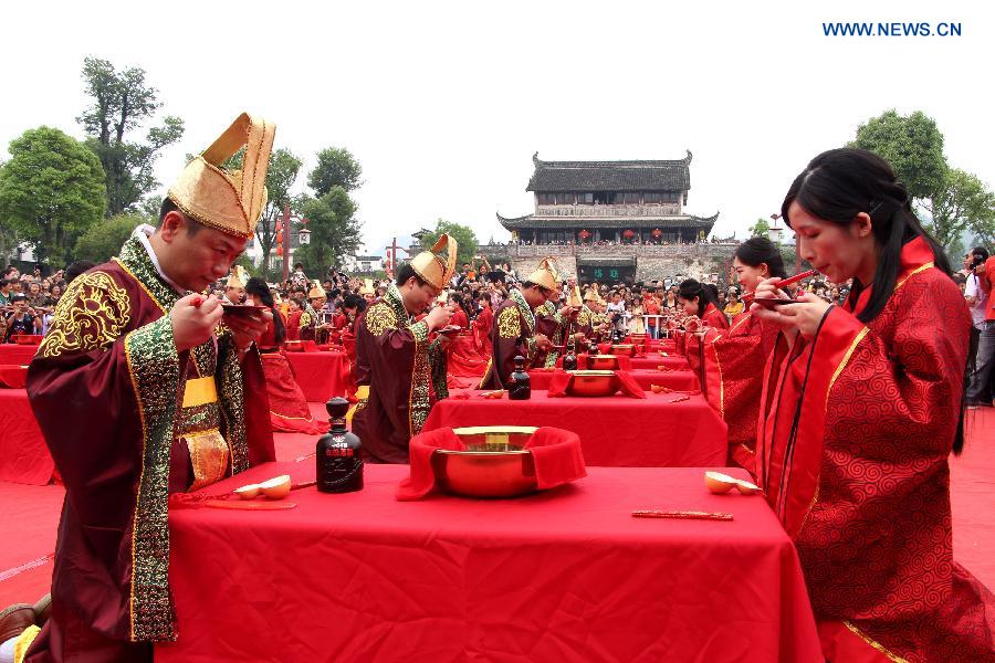 A total of 24 couples attended the wedding ceremony which followed the nuptial rites of Han Dynasty (220 B.C.-220 A.D.) on Sunday.