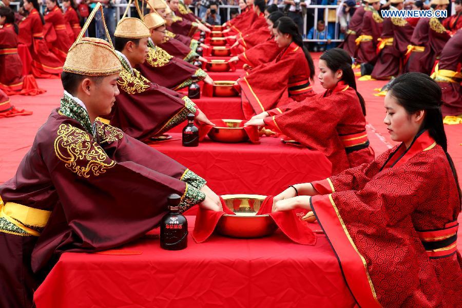 A total of 24 couples attended the wedding ceremony which followed the nuptial rites of Han Dynasty (220 B.C.-220 A.D.) on Sunday.