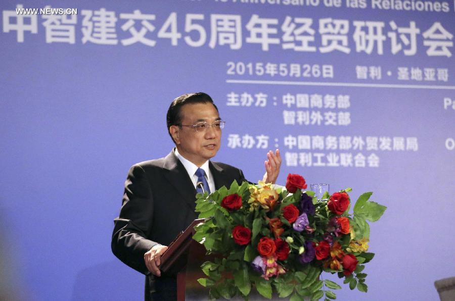 Chinese Premier Li Keqiang addresses the opening of an economic and trade seminar marking the 45th anniversary of the establishment of China-Chile diplomatic relations and the seventh meeting of the China-Chile Business Council in Santiago, capital of Chile, May 26, 2015.