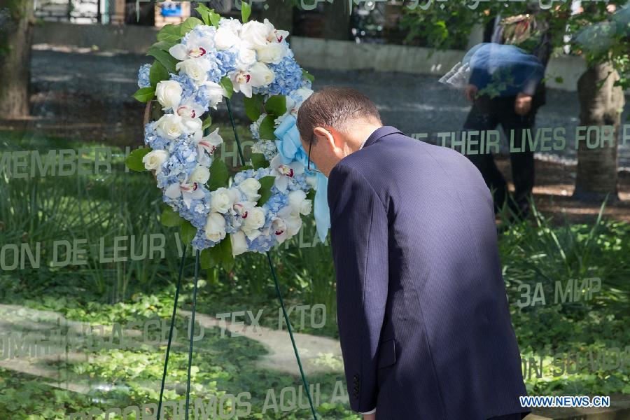 UN Secretary-General Ban Ki-moon pays tribute to peacekeepers who died in UN peacekeeping operations worldwide during a wreath-laying ceremony on the occasion of the International Day of United Nations Peacekeepers, at the United Nations headquarters in New York, United States, May 29, 2015. 