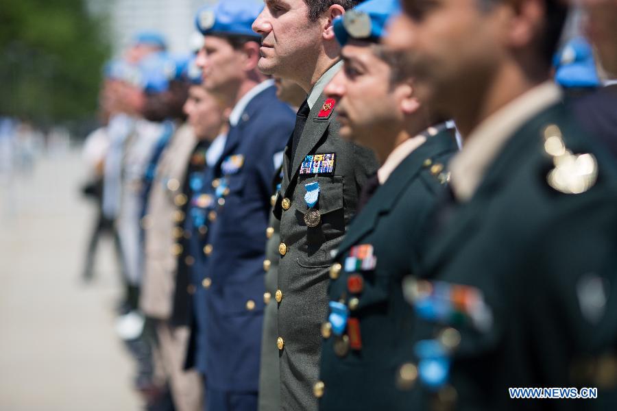 44 military and police personnel from 25 countries are awarded UN medals for their contributions to UN peacekeeping operations during service medal ceremony at the UN headquarters in New York, United States, May 29, 2015. 