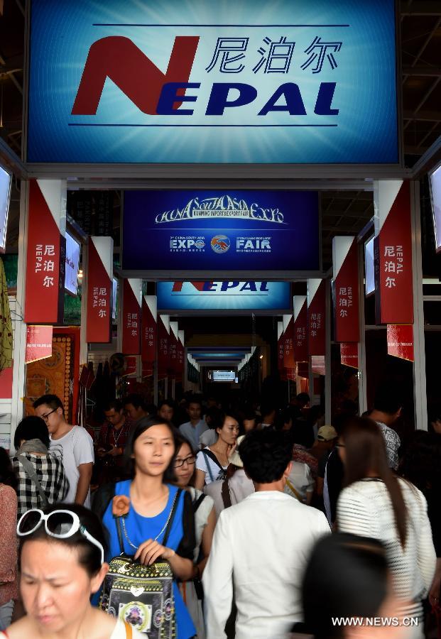 People visit the 23rd Kunming Import and Export Fair in Kunming, capital of southwest China's Yunnan Province, June 15, 2015.