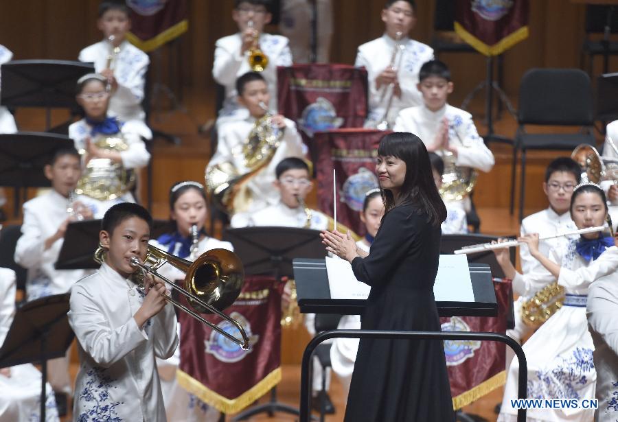 Bandsmen of a student wind band from Beijing No. 2 Experimental Primary School perform at the National Center for the Performing Arts in Beijing, capital of China, June 16, 2015. 