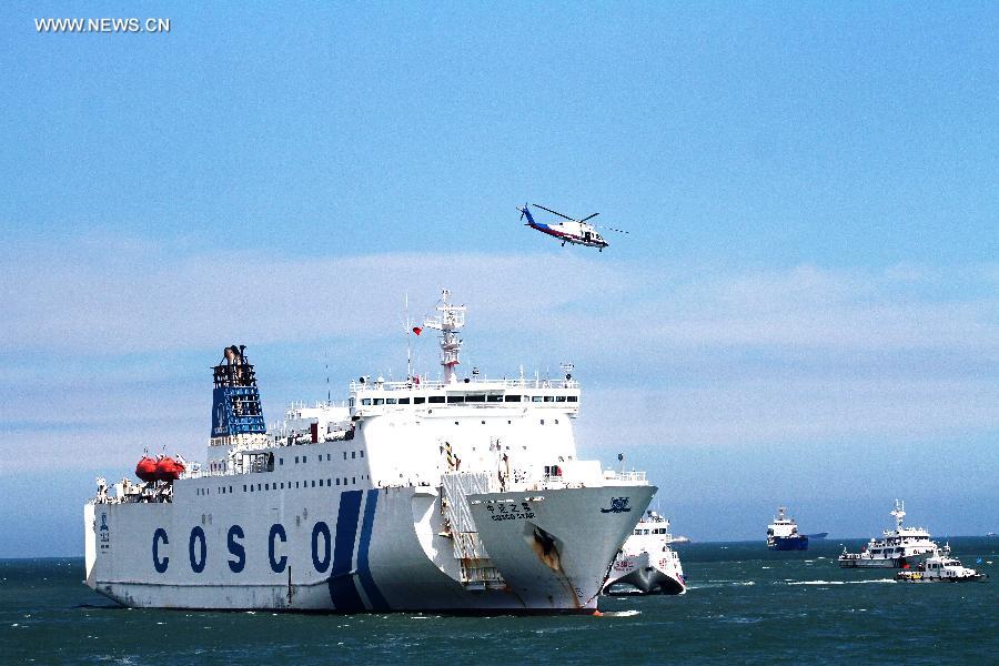  passenger vessel takes part in a rescue drill in Xiamen, southeast China's Fujian Province, June 15, 2015. 