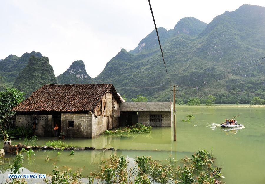 A house is flooded at Longchang Village in Mashan County, southwest China's Guangxi Zhuang Autonomous Region, June 16, 2015.