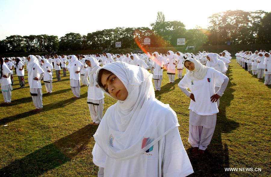 Kashmiri school children practise yoga on the first International Yoga Day in Srinagar, summer capital of Indian-controlled Kashmir, June 21, 2015.