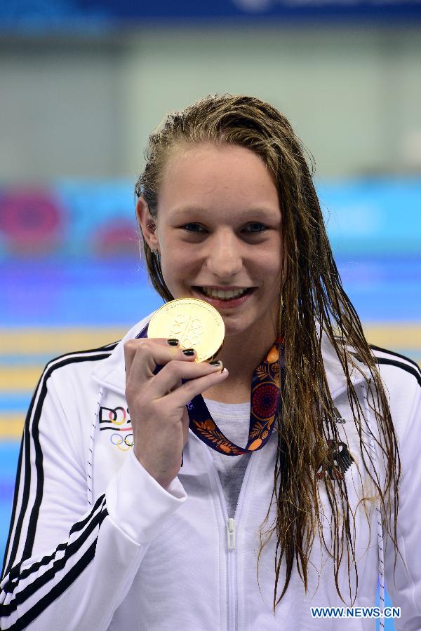 Julia Mrozinski of Germany displays her gold medal during the awarding ceremony for the women's 200m butterfly final at the European Games in Baku, Azerbaijan, June 24, 2015. 