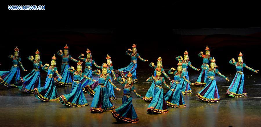 Dancers perform in a folk dance drama in Hohhot, capital city of north China's Inner Mongolia Autonomous Region, June 26, 2015. 