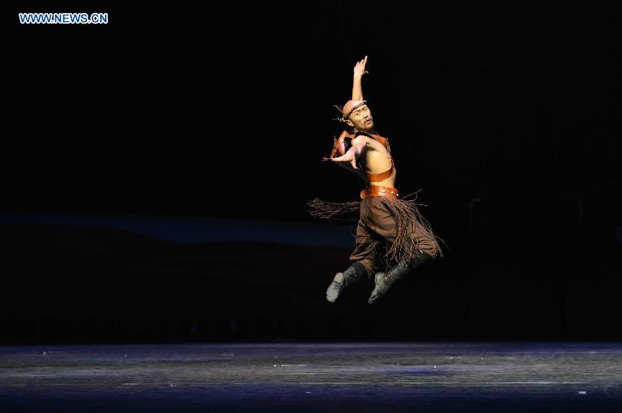 A dancer performs in a folk dance drama in Hohhot, capital city of north China's Inner Mongolia Autonomous Region, June 26, 2015.