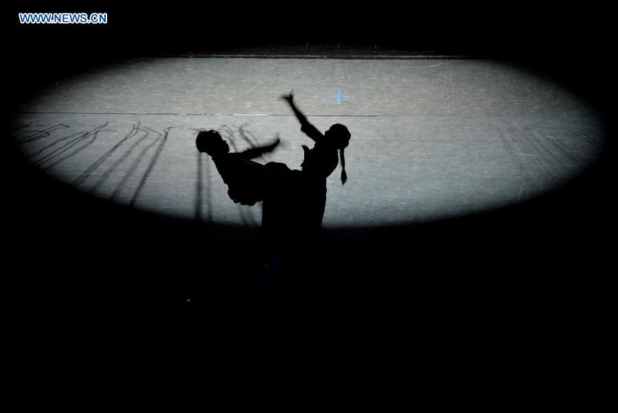 Dancers perform in a folk dance drama in Hohhot, capital city of north China's Inner Mongolia Autonomous Region, June 26, 2015.